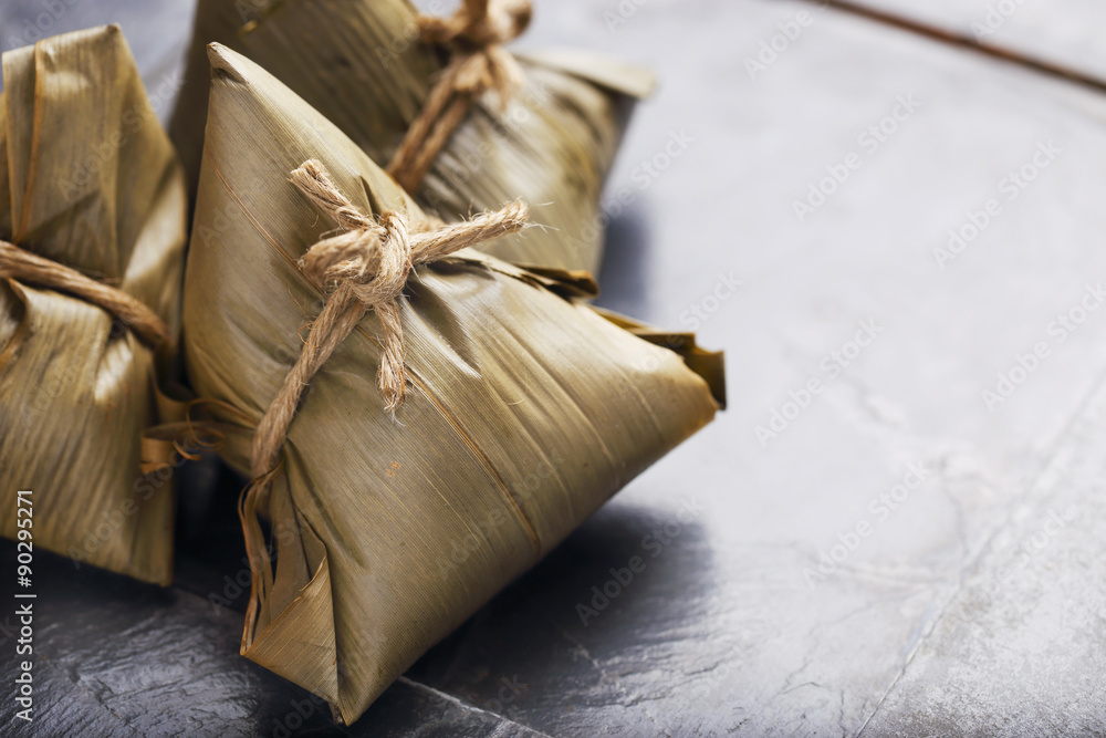 Asian Chinese Rice Dumpling, Zongzi, on Black Background. Asian Chinese Rice Dumpling, Zongzi, on Black Background.