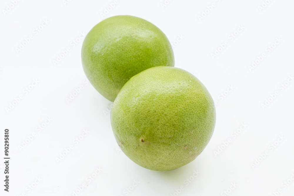close up of fresh limes isolated on white close up of fresh limes isolated on white