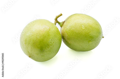close up of fresh limes isolated on white