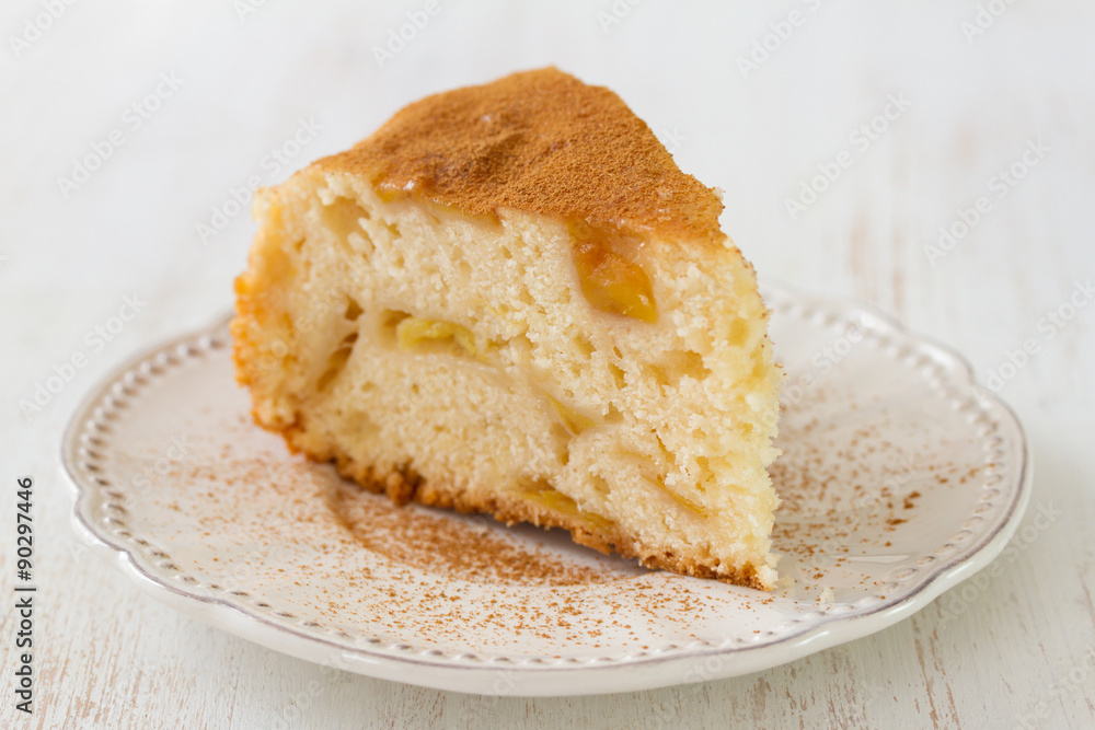 apple pie on white plate on white wooden background