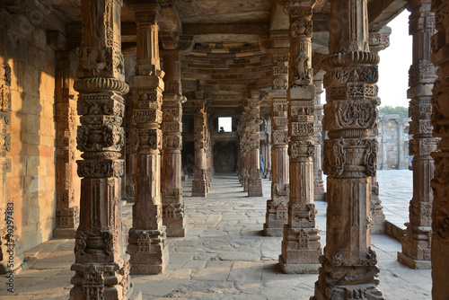 Carving Sandstone Columns in the courtyard of Quwwat-Ul-Islam mosque inside Qutub Minar complex