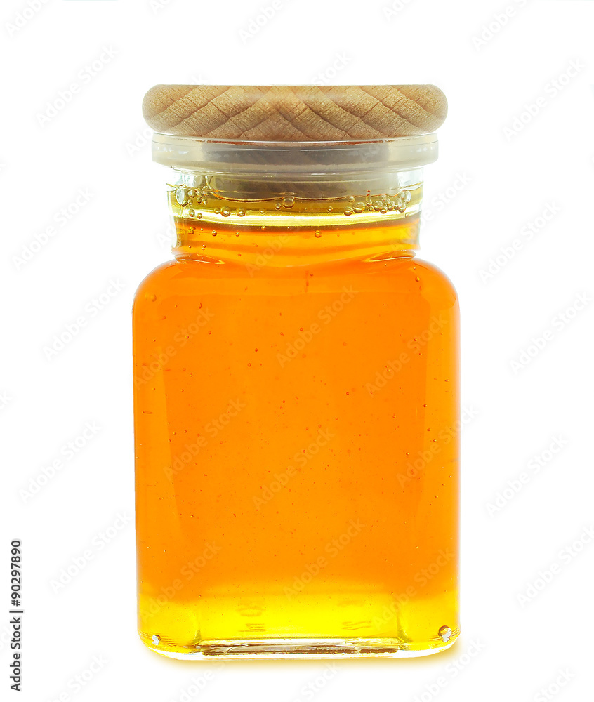 honey in a jar isolated on white background honey in a jar isolated on white background