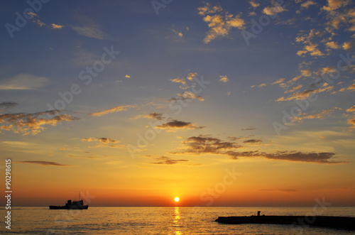   the sun sets in the sea. stunning views. On the horizon ships.    ship, boat, clean the bottom of the sea. © srubina