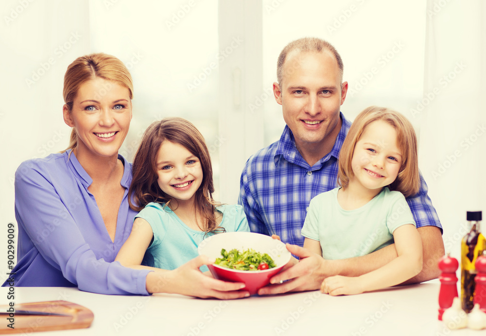 happy family with two kids with salad at home