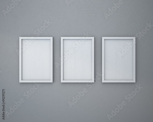 3 Blank frame on gray wall.