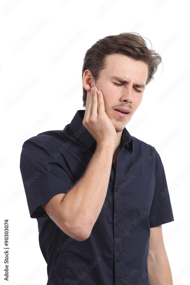 Casual man suffering toothache with hand pressing on face Casual man suffering toothache with hand pressing on face
