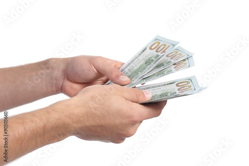 Man hands holding and counting money