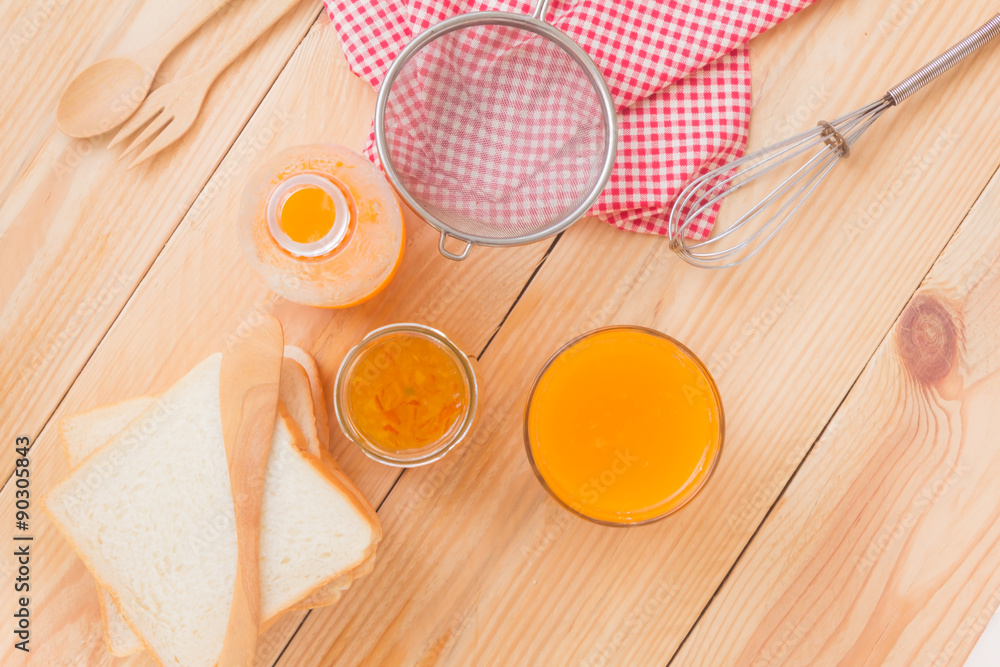 Breakfast with bread, jam and orange juice, top view Breakfast with bread, jam and orange juice, top view