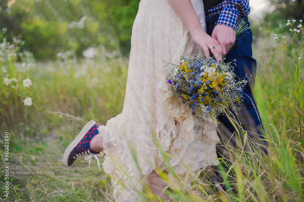 Young healthy couple fashionable girl in a wedding dress guy in a