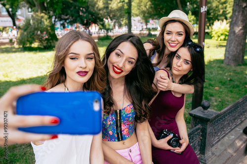 four beautiful young girls make selfie 