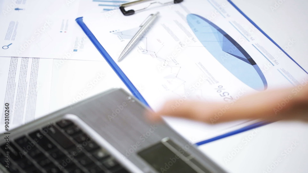 businessman hands with laptop and papers in office businessman hands with laptop and papers in office