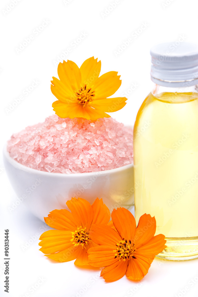 Spa and wellness setting with sea salt, oil essence, flowers. Spa and wellness setting with sea salt, oil essence, flowers.