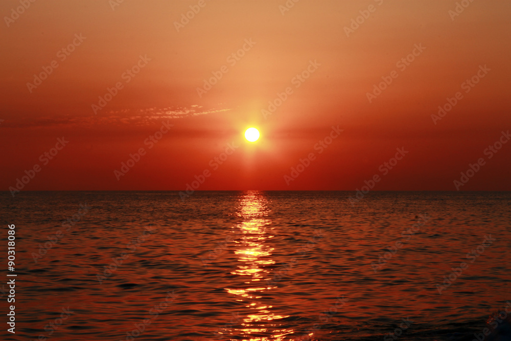 Sunset over the Black sea and summertime beach