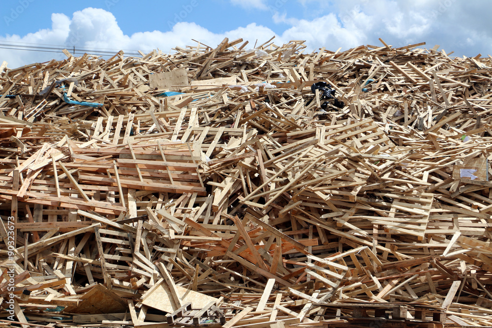 Huge pile of used broken pallets on factory field Huge pile of used broken pallets on factory field