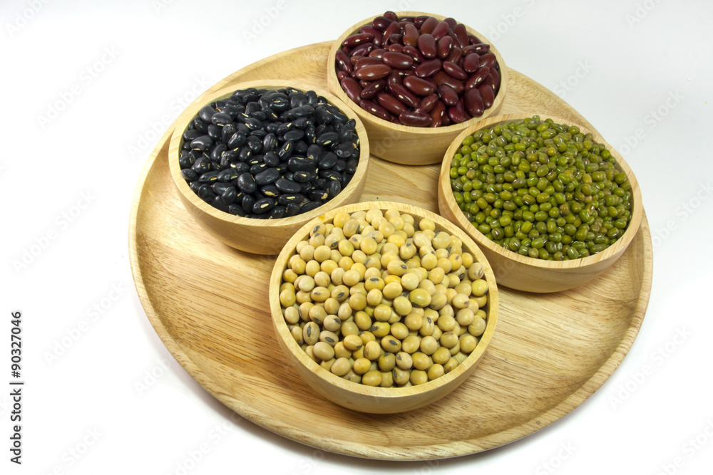 Mixed beans and lentils in the wooden bowl isolated on white background. mung bean, soybean, red kidney bean , black bean ,red bean,green bean. Mixed beans and lentils in the wooden bowl isolated on white background. mung bean, soybean, red kidney bean , black bean ,red bean,green bean.