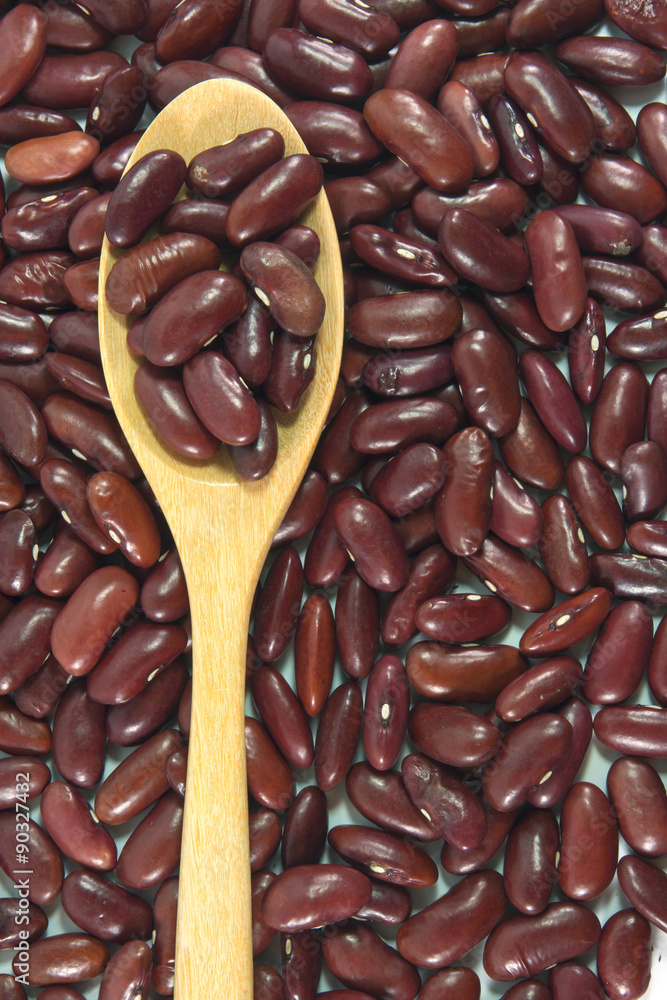 Spoon with red beans background texture