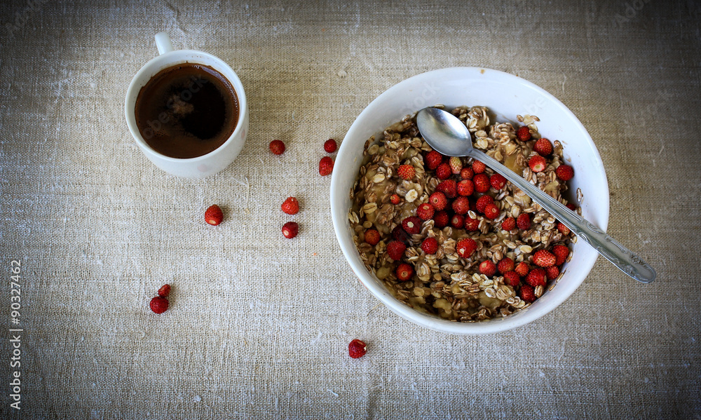 strawberries and oat meal with cups of coffee strawberries and oat meal with cups of coffee