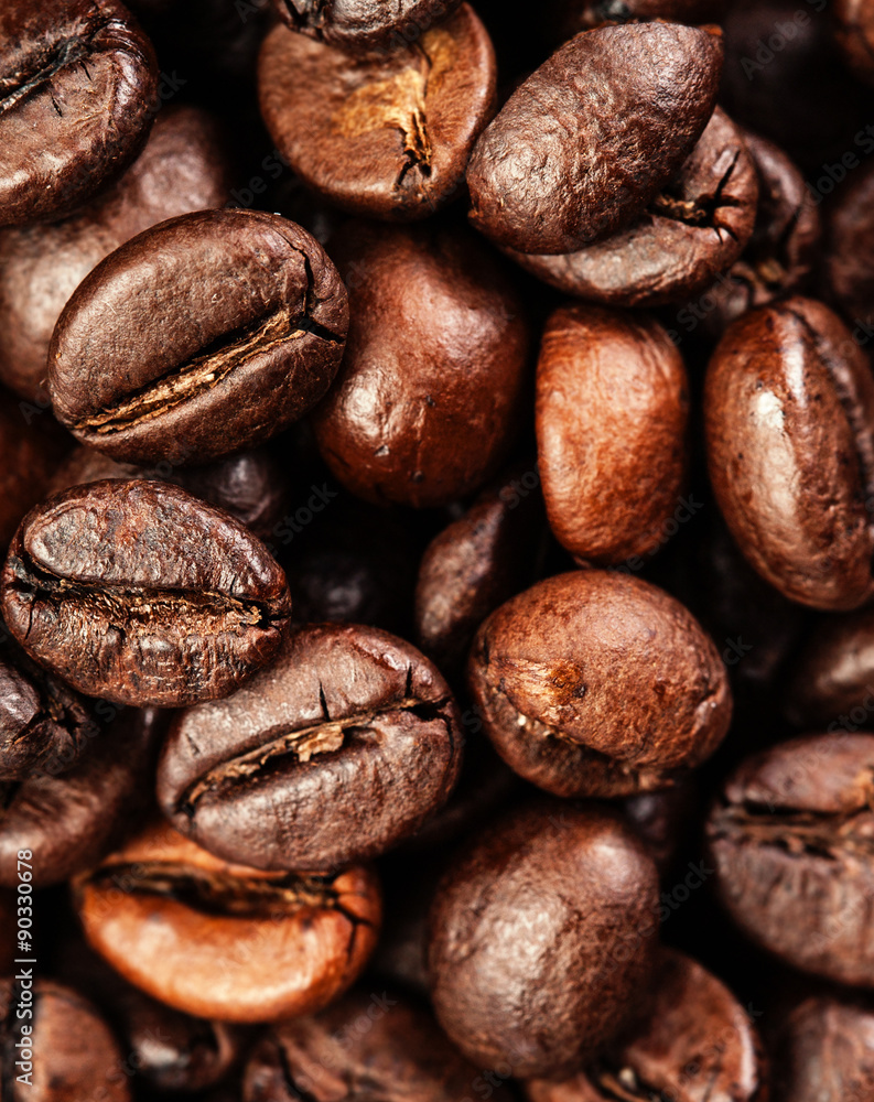 Naklejka premium Brown coffee beans, close up of coffee beans for background and