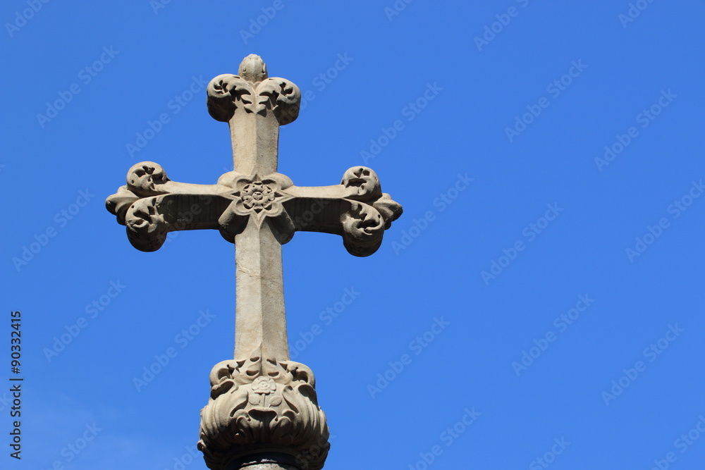 Christian cross on blue sky background