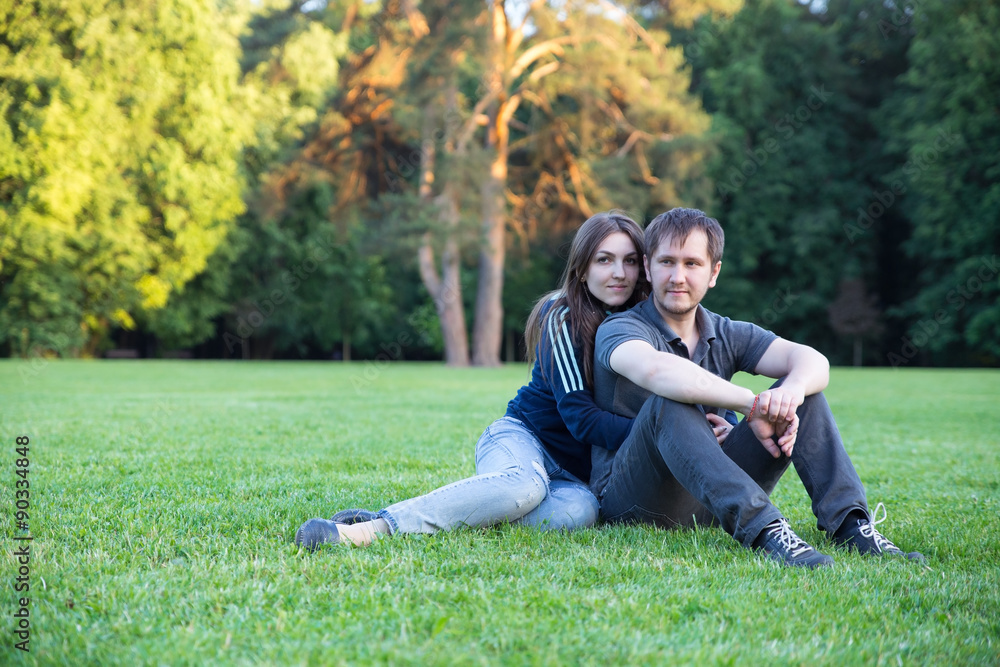 Happy couple in love at summer park