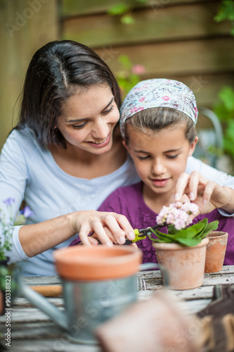 Portrait of a mother daughter special moment. Gardening discovering and teaching