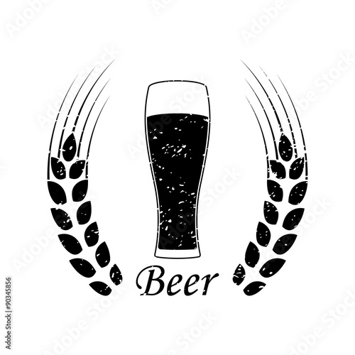 A glass of beer and a silhouette of wheat ears