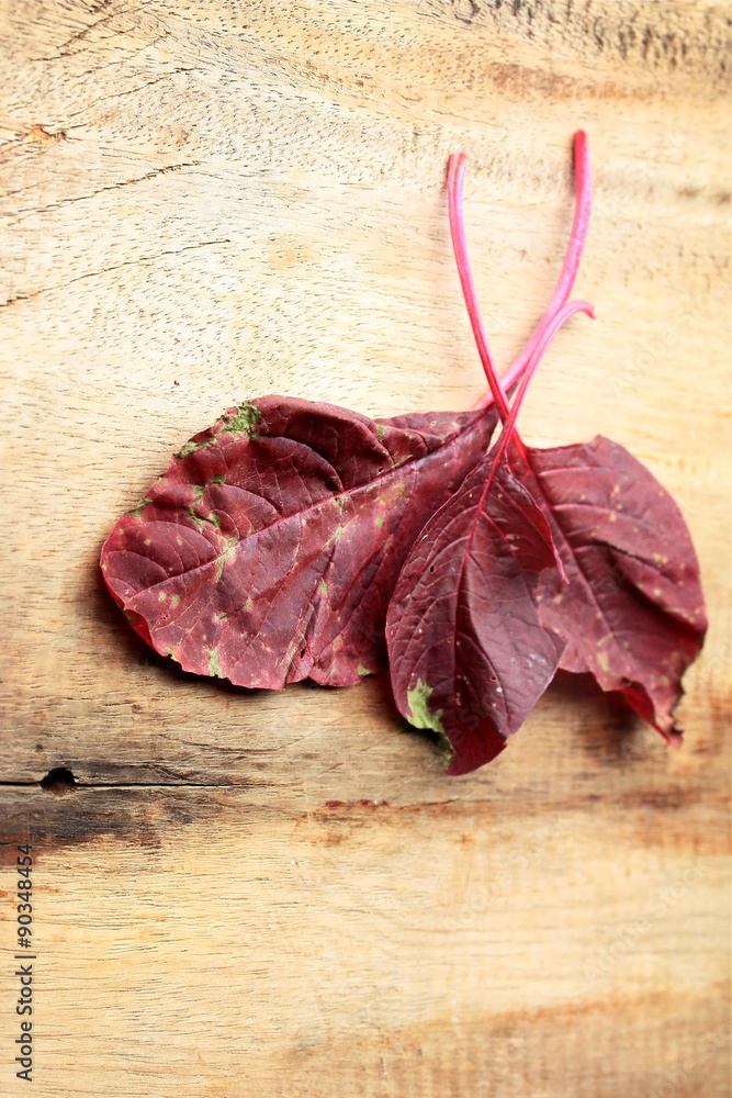 red spinach on a wooden vintage