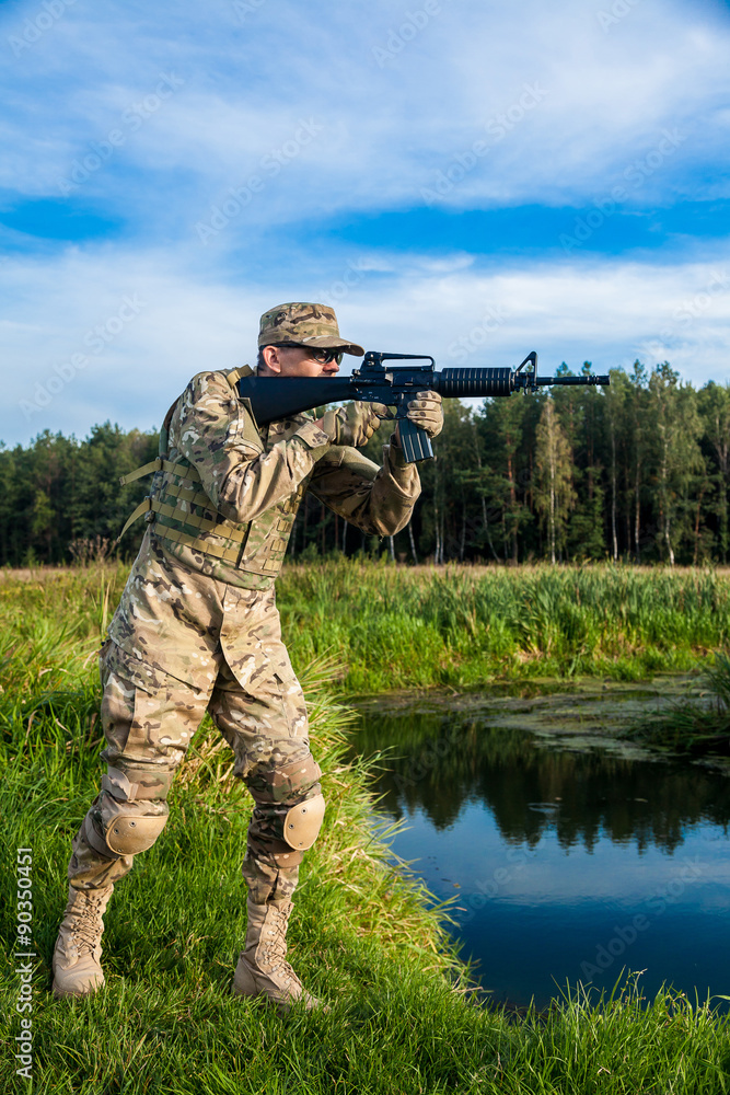 Fototapeta premium Soldier with a rifle