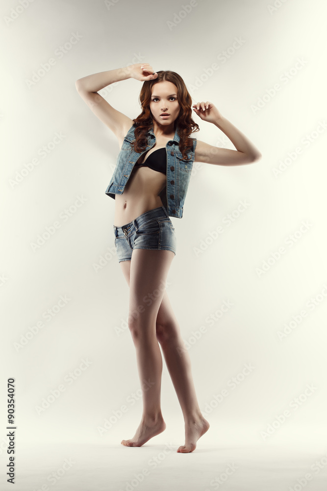 Image of cute teen model posing in jeans clothes Stock Photo | Adobe Stock