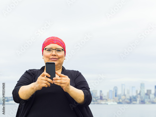 Woman Takes Selfie With Downtown Skyline In Background