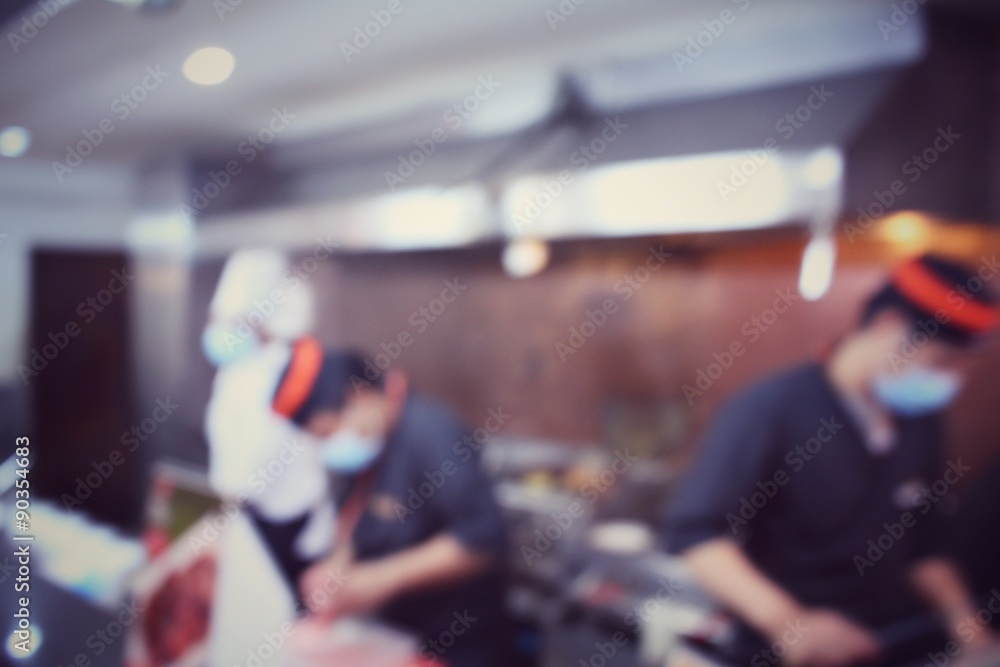 Blurred of japanese chef in restaurant Blurred of japanese chef in restaurant