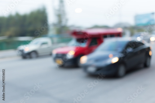 car driving on road with traffic jam in the city  abstract blurred