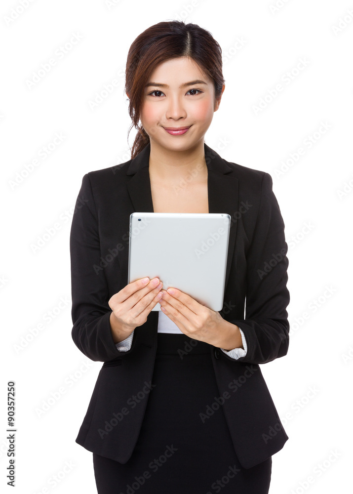 Asian young businesswoman use of the tablet pc Asian young businesswoman use of the tablet pc