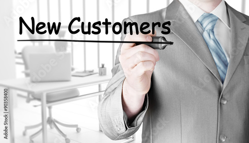 businessman writing new customers