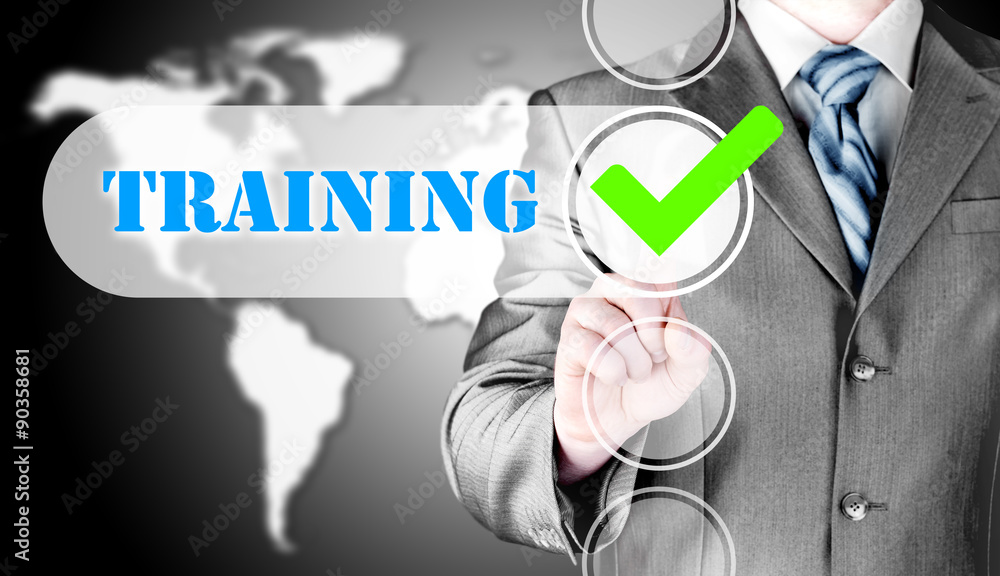 Businessman pressing touch screen interface training checkbox Businessman pressing touch screen interface training checkbox