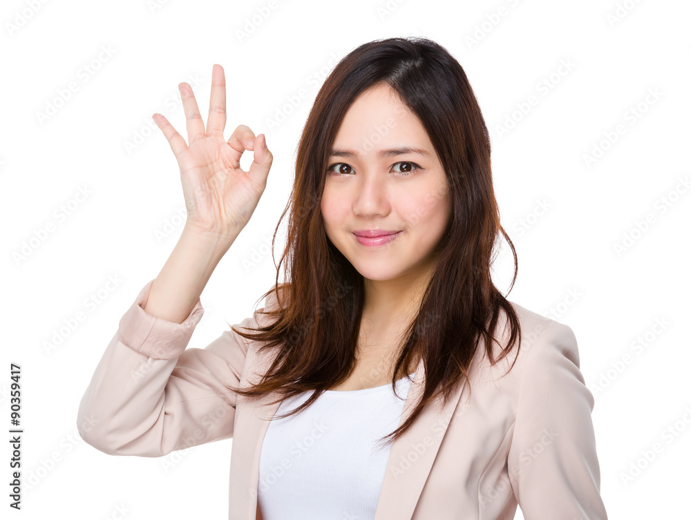 Young businesswoman hold with ok sign gesture Young businesswoman hold with ok sign gesture