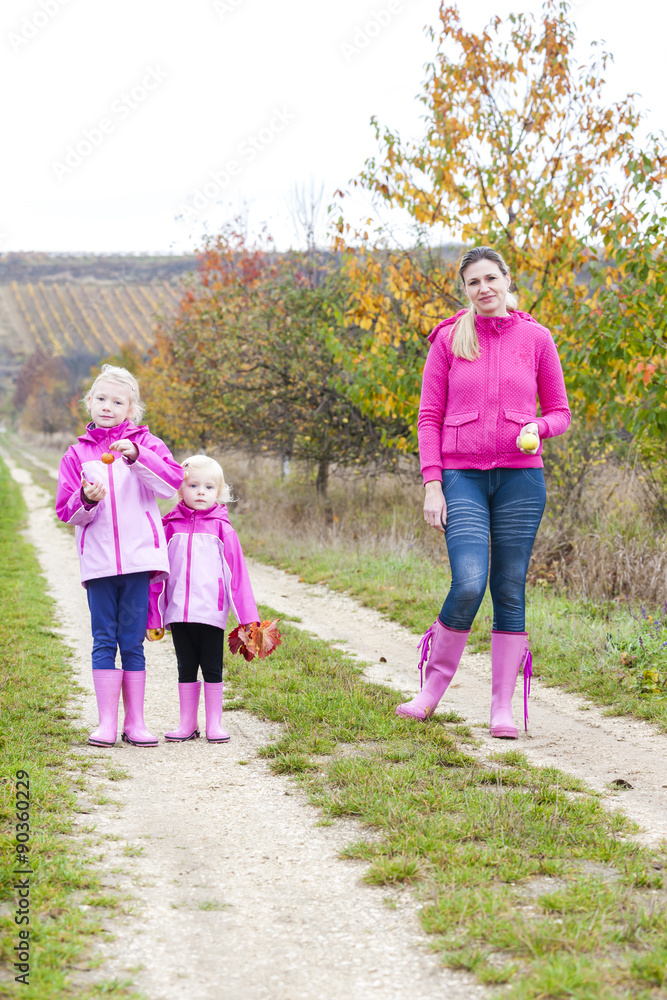 mother and her daughters in autumnal nature mother and her daughters in autumnal nature