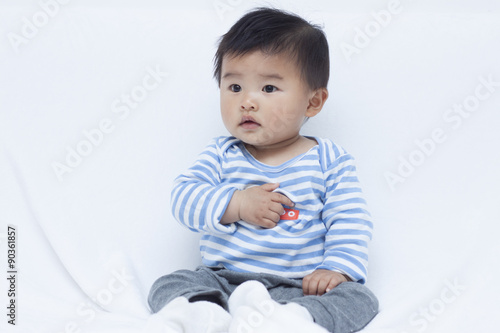 Cute Chinese baby boy in sailor suit