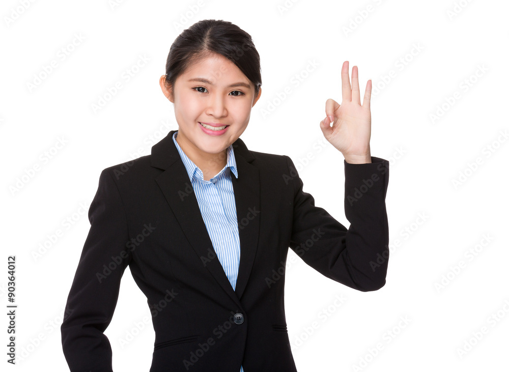 Asian businesswoman with ok sign gesture Asian businesswoman with ok sign gesture