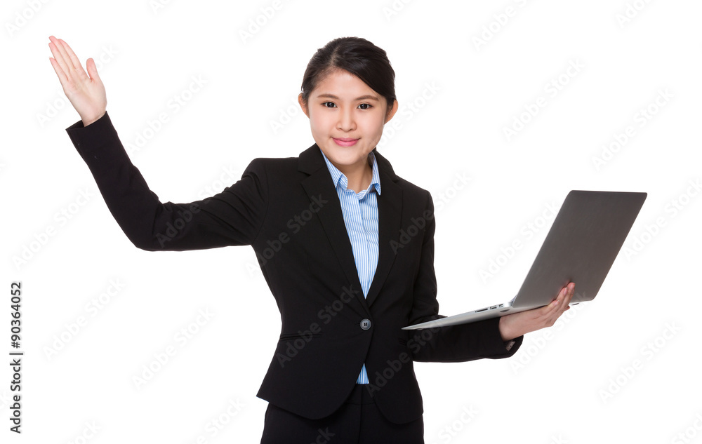 Asian Young businesswoman hold with laptop computer and open han Asian Young businesswoman hold with laptop computer and open han
