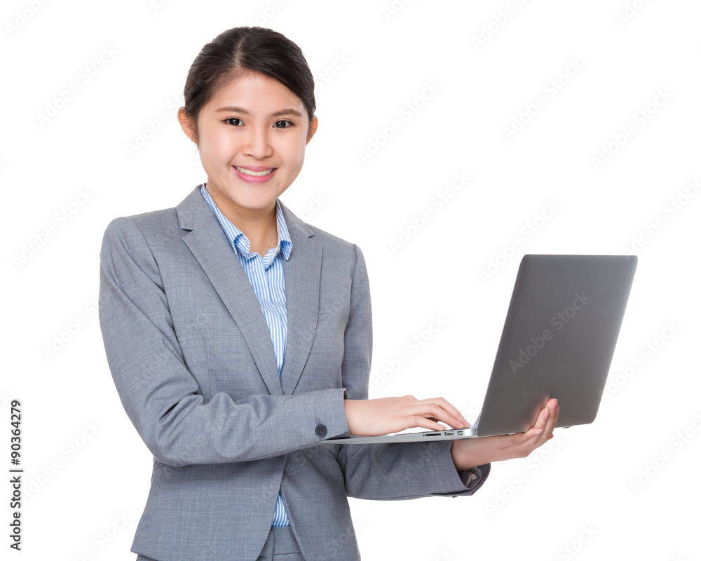 Asian businesswoman use of the notebook computer Asian businesswoman use of the notebook computer