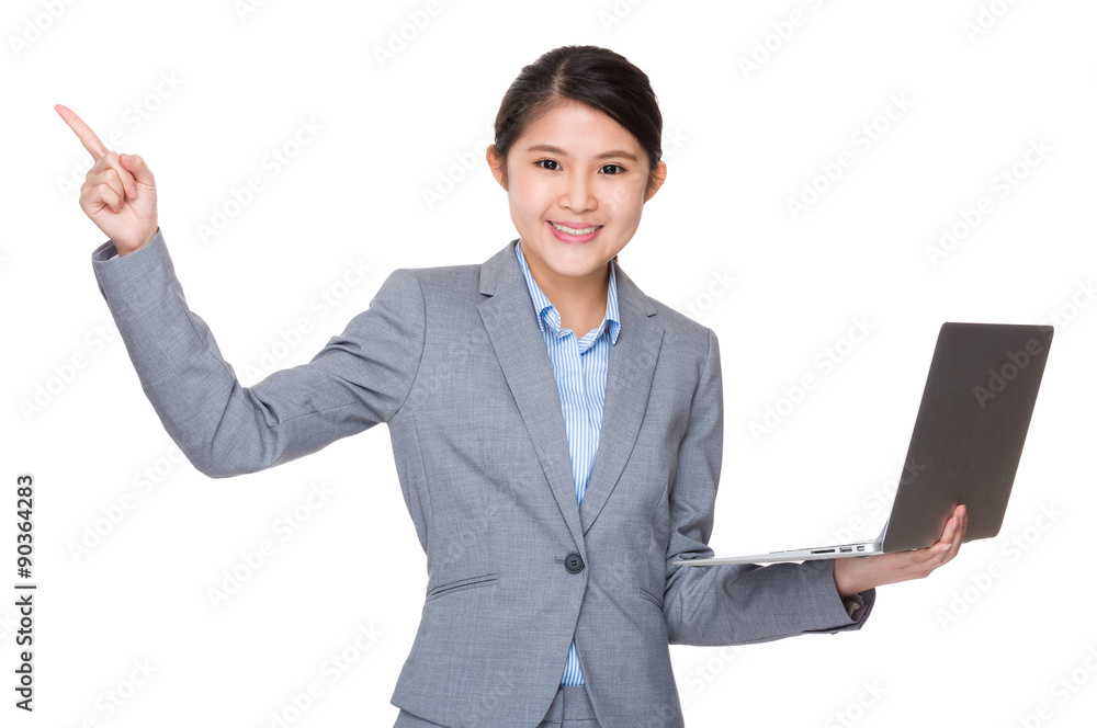 Asian young businesswoman hold with laptop computer and finger p Asian young businesswoman hold with laptop computer and finger p