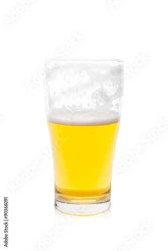 Isolated single glass of beer with bubbles