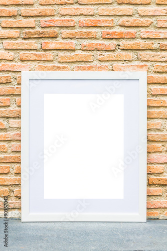 Blank frame on brick wall background
