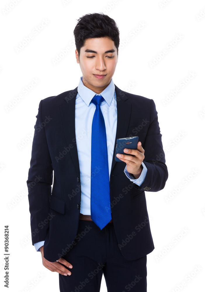 Asian young Businessman use of the cellphone Asian young Businessman use of the cellphone