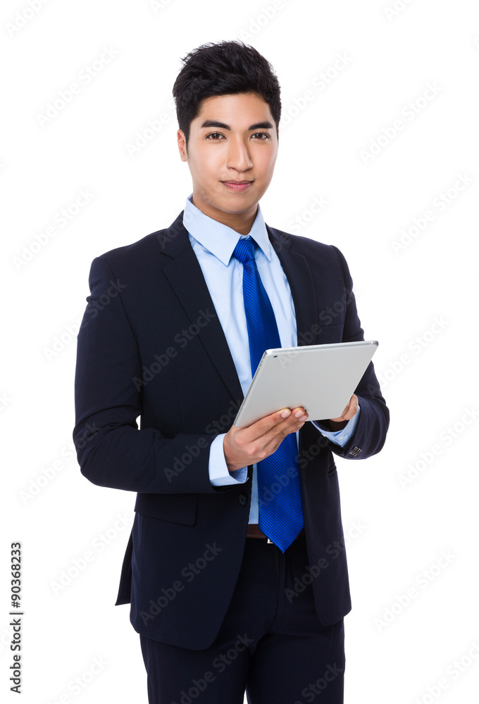Young Businessman use of the digital tablet Young Businessman use of the digital tablet