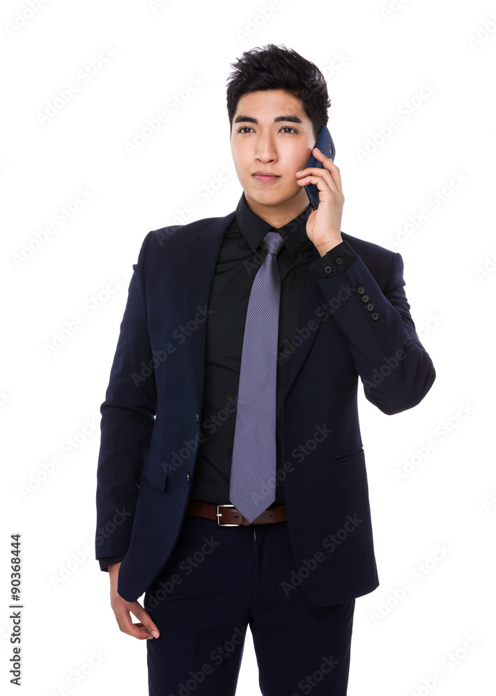 Asian businessman talk to smartphone Asian businessman talk to smartphone