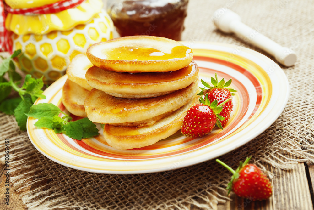 Homemade pancake with honey and strawberry Homemade pancake with honey and strawberry
