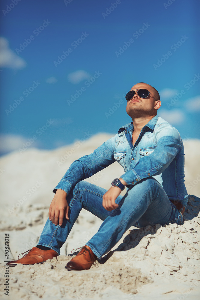Man Relaxing On Beach