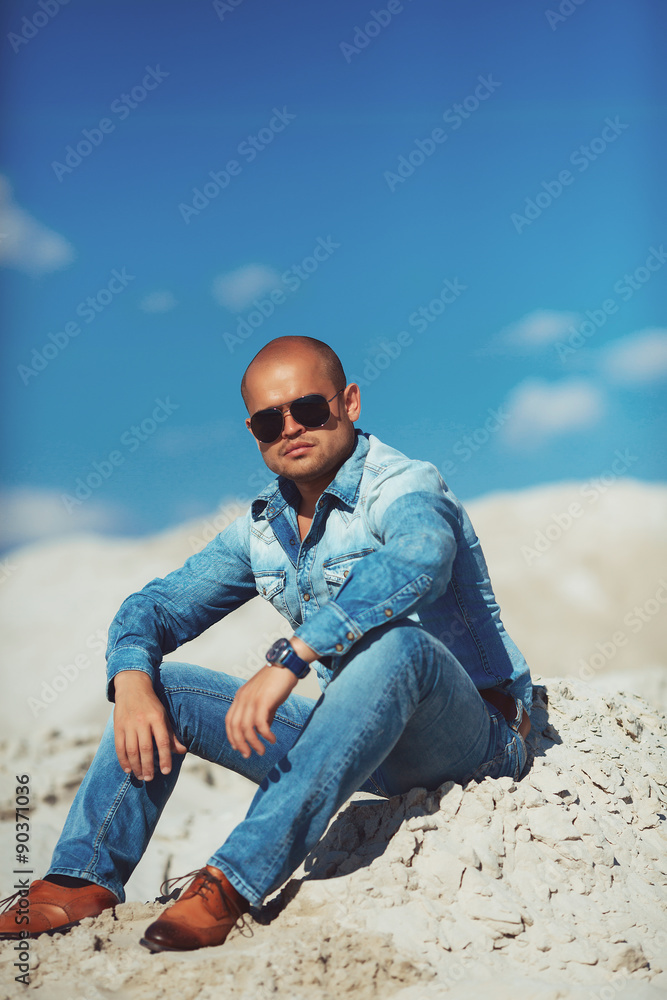 Young Attractive Man Relaxing at the Beach Young Attractive Man Relaxing at the Beach
